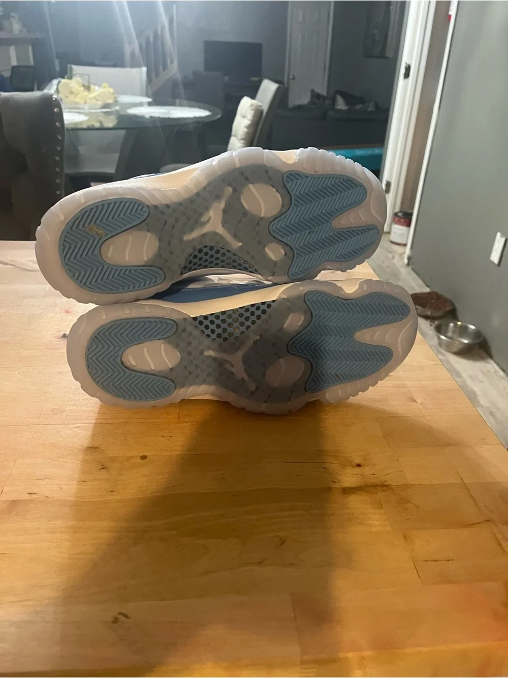 UNC Jordan 11 Low-Top Sneakers in White and Light Blue Patent